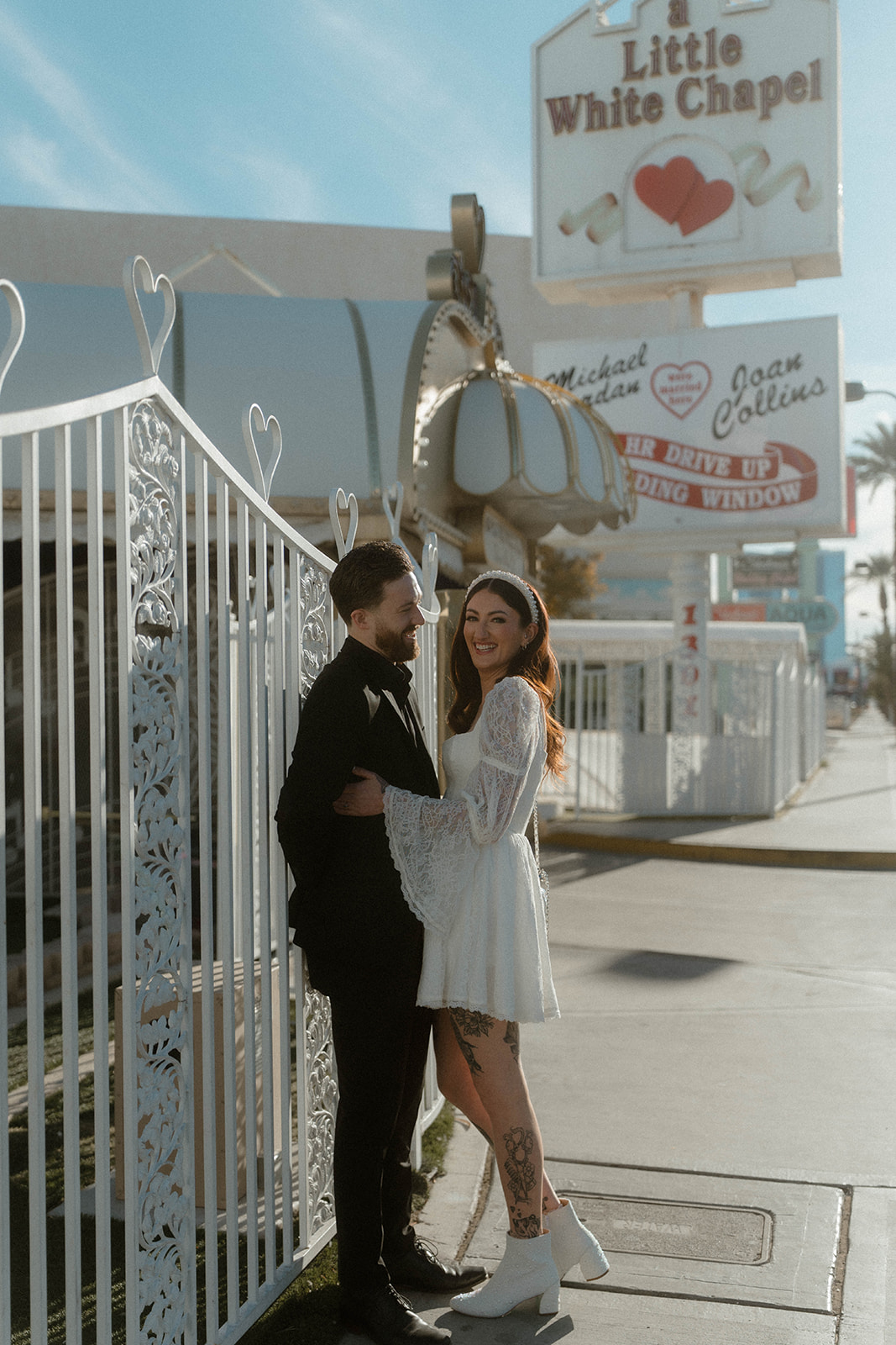 little white wedding chapel sign sidewalk photo of the bride and groom forever-club